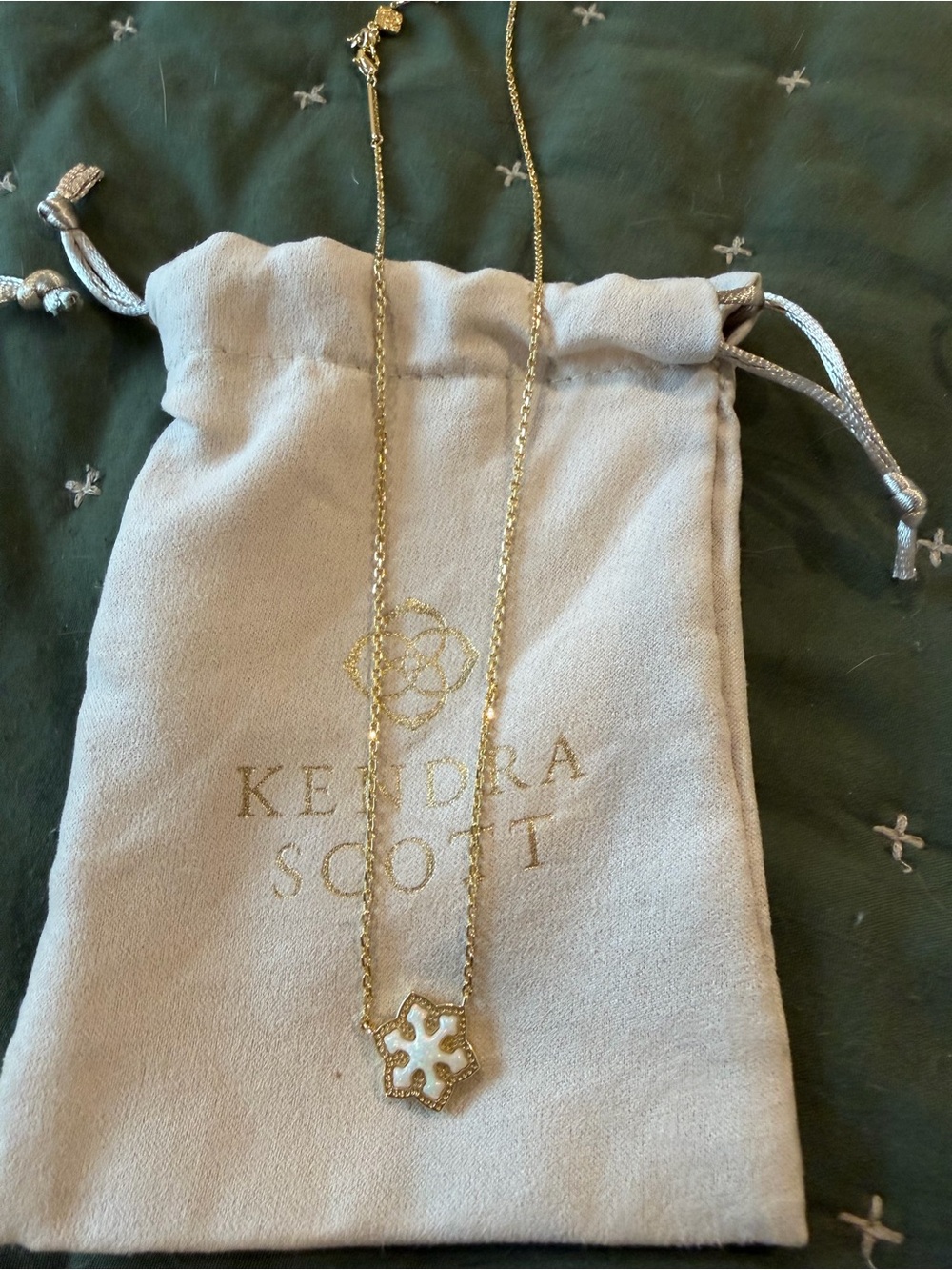 Kendra Scott Gold Necklace with White Enamel snowflake Pendant